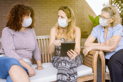 How to Start a Cleaning Business After COVID, Three Women Sitting and Wearing Masks