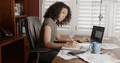 How to Start a Cleaning Business After COVID, Woman Working at Desk