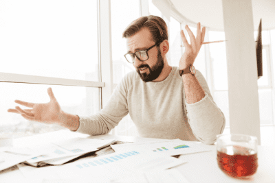 Start a Cleaning Company in Another Country, Confused Man Looking at Paperwork