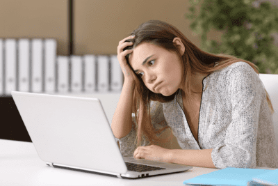 Start a Cleaning Company in Another Country, Confused Woman on Computer