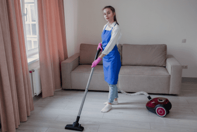Vacuum Warranties What You Need to Know, Woman Vacuuming Floor