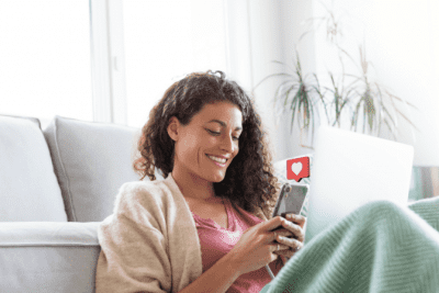 Facebook Friends With Your Customers, Smiling Woman with Phone
