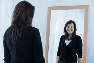 How Do You Sound Experienced, Woman Looking in Mirror