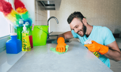 Living With a House Cleaner, Man Cleaning Counter