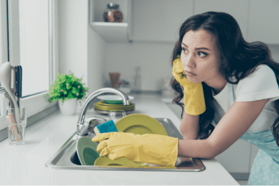 Living With a House Cleaner, Woman Thinking While Washing Dishes