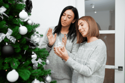 Upsells for the Holidays, Women Decorating Christmas Tree