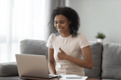 Should You Tell Employees You're New, Woman on Computer Giving Thumbs Up