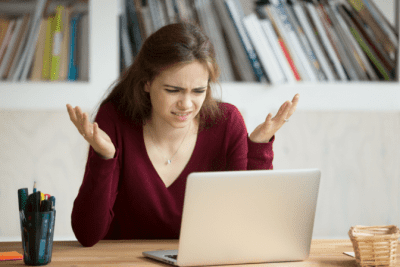 Are You Winging It With Your Money, Confused Woman on Computer