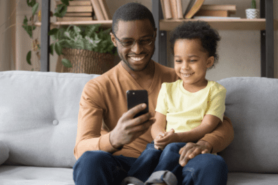 Zoom Walkthrough, Man and Child Look at Phone