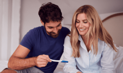 Cleaning While Pregnant, Couple Look at Pregnancy Test