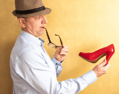 Cross-Dressing While Cleaning, Man Looking at Shoe