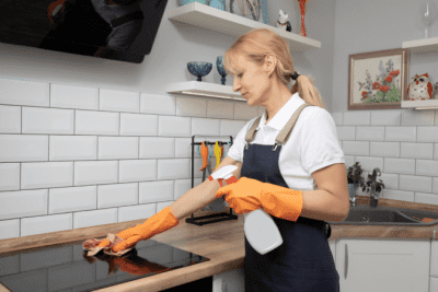 Cross-Dressing While Cleaning, Woman Cleaning Stove