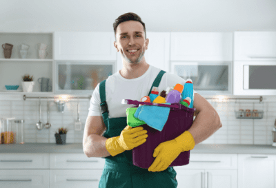 Why Uniforms Work, Happy House Cleaner Holding Cleaning Supplies