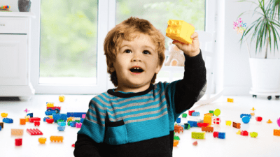 Big Sister's Secret to Cleaning, Little Boy Holding Yellow Block