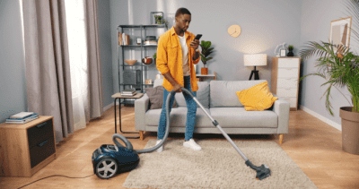 Resources for Cleaning, House Cleaner Vacuuming and Looking at Phone