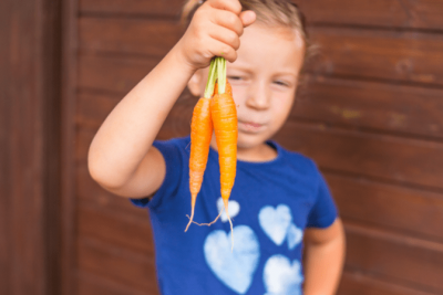 Faith or Fear, Child Holding Carrots